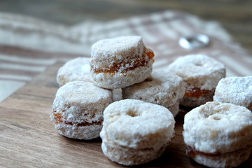 Cookies with jam on the wooden table