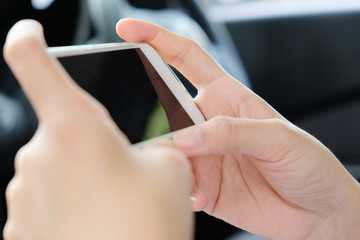 Woman Sitting in the Car and Using Smart Phone