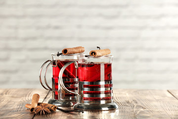 glasses of tea and wooden table place 