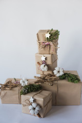 Christmas decorations eco cotton flowers, cinnamon,stars, spruce branches and jute rope hank over white background,holiday,xmas,christmas 