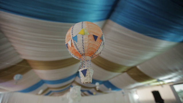 Decorative multicolored balloon in a festive tent