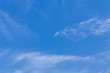 wind blows clouds in blue sky background