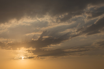 sunset sky background, light rays of sunbeam in evening