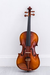 Naklejka na ściany i meble Classical cello on white wall background