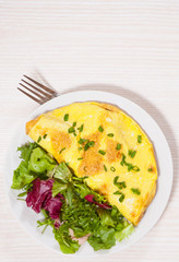 omelet with fresh mixed salad leaves