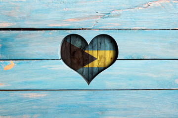 Love Bahamas. Heart and flag on a blue wooden board
