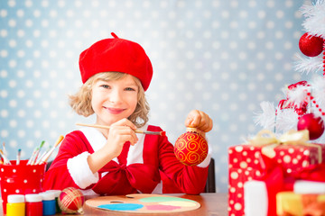 Child with Christmas gift boxes