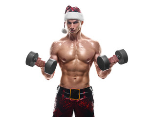 Fototapeta na wymiar Holidays and celebrations, New year, Christmas, sports, bodybuilding, healthy lifestyle - Muscular handsome sexy Santa Claus