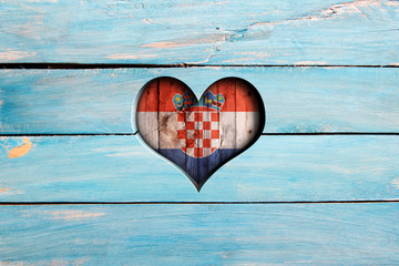 Love Croatia. Heart and flag on a blue wooden board