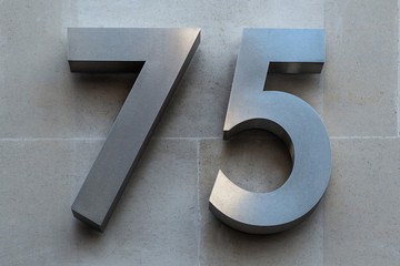 75 number on a building.