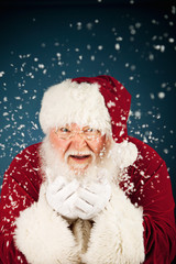 Santa: Santa Claus Blowing Snow