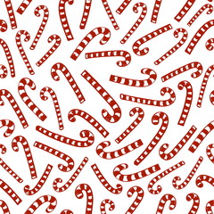 seamless red striped Christmas candy canes on a white background