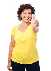 portrait of a mature woman with thumb up