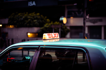 Honk Kong night taxi sign