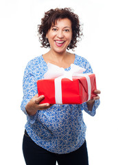 portrait of a mature woman holding a gift on a white background