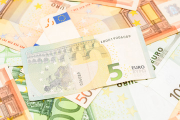 Five Euro Banknote On Euro Bills Background
