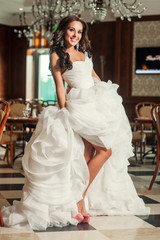 Woman bride in wedding dress indoor