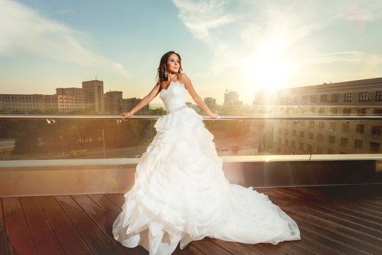 Woman bride in wedding dress in the city