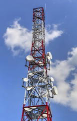 Communication antenna tower on blue sky