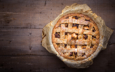 Apple/pear pie in a baking pan, with ingredients.