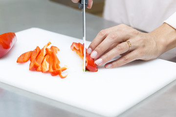 Closeup on woman cutting fresh vegetables