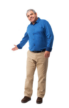 full body mature man doing a welcome gesture