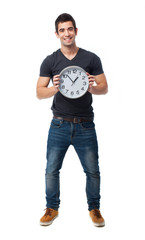 full body young man holding a clock over white