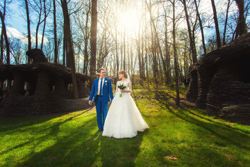 Bride, groom and autumn forest