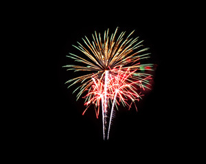 Fototapeta premium Colorful fireworks of various colors on black background