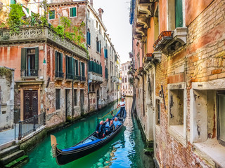 Fototapeta na wymiar Gondola on canal in Venice, Italy