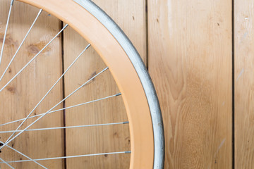 bicycle parked with wood wall, close up image part of bicycle