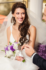 Happy bride and groom at wedding in the room