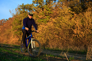 Obraz premium Cyclist Riding the Bike