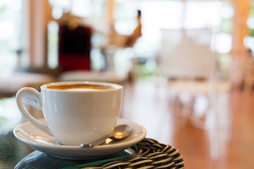 coffee cup on table with blur interior cafe coffee shop