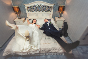 Happy bride and groom at wedding in the room