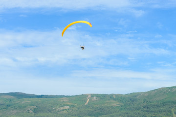 trike with a parachute against the blue sky