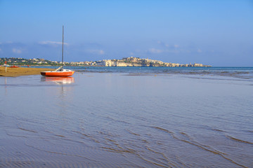 SUMMER. Gargano coast:Portonuovo beach.In the background the city of Vieste.(Puglia)- ITALY-