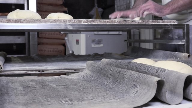 rolling and shaping french baguette dough bread