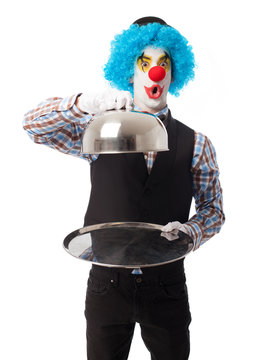 portrait of a funny clown presentating an object