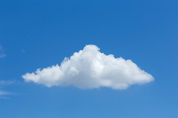 single cloud on clear blue sky background