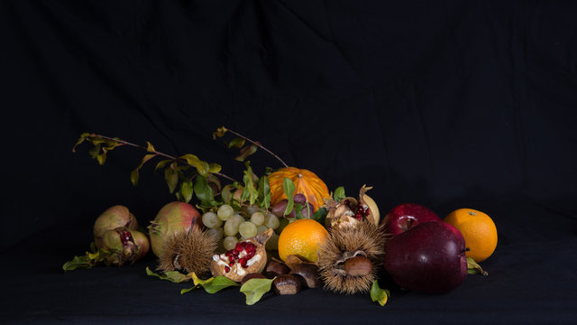 Autumnal still life 1 / Group of autumnal fruits and vegetables on a black background.