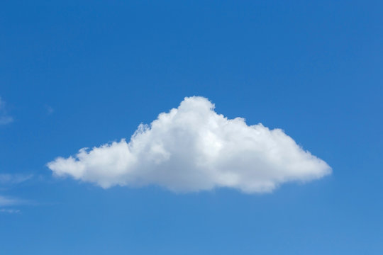 single cloud on clear blue sky background
