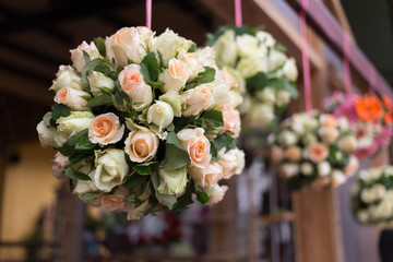 wedding ceremony decoration with white bouquet rose hanging