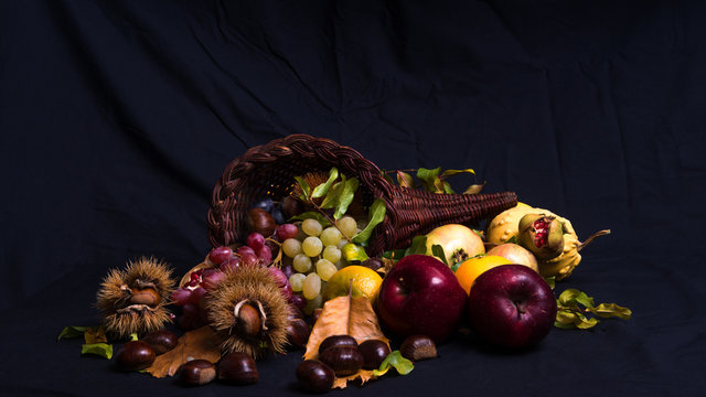 Autumnal still life 2 / Group of autumnal fruits and vegetables on a black background.
