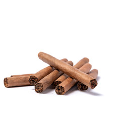 Brown cigar burned on white background