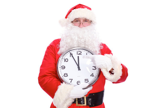 Kind Santa Claus pointing to clock, isolated on white background