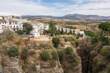 Fototapeta na wymiar View down the steep rockface to valley in Ronda