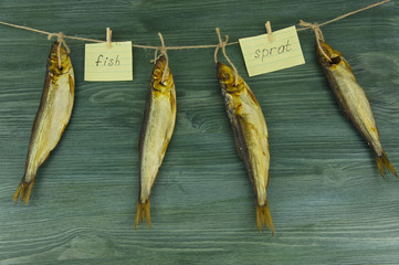 herring sprat fish smoked wooden table