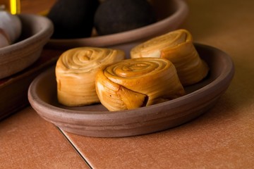 Three pieces smoked rolled cheeses on bowl