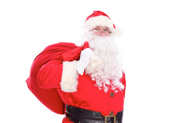 Kind Santa Claus carrying big bag, isolated on white background
